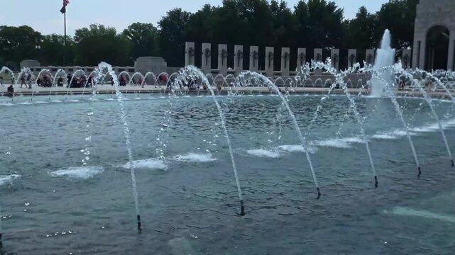 Travel and Landmarks: Close Up View of Water Jets in Rainbow Pool Fountain at National World War II Memorial in Washington DC