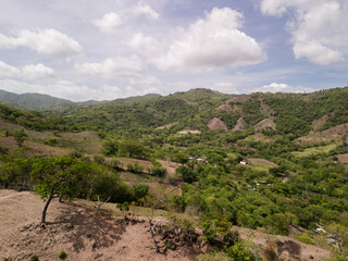 Naklejka premium Green hills on blue sky background