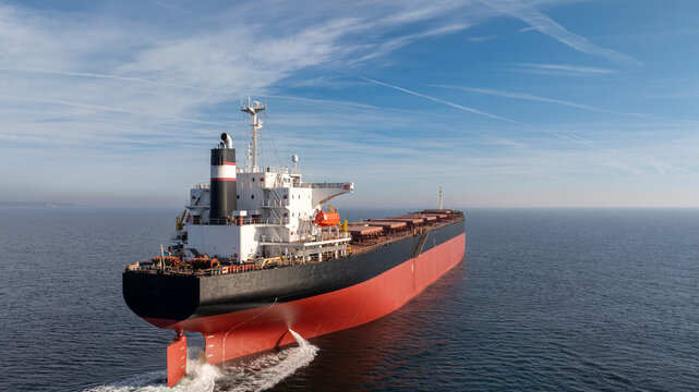 Massive bulk carrier ship Sailing in the Open Ocean, Industrial Freighter for Maritime Shipping, Logistics, Trade, and Transportation