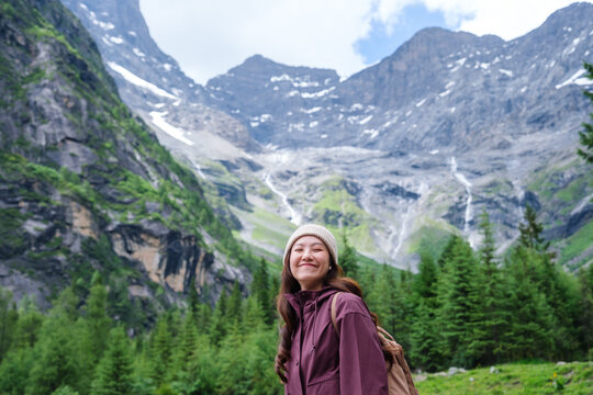 Portrait image of a woman with mountain range in summertime, Chengdu, China