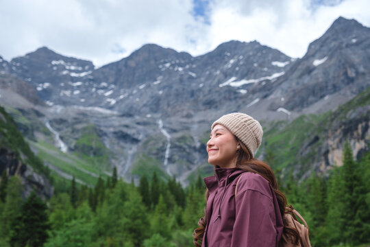 Portrait image of a woman with mountain range in summertime, Chengdu, China