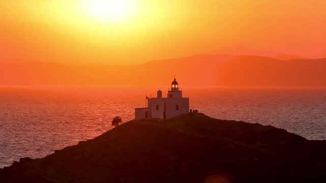 Close-up view of the lighthouse at the island of Kea - Tzia, Cyclades, Greece, during a beautiful summer sunset