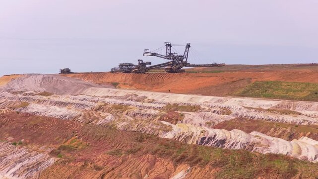 Giant bucket wheel excavator operating in open pit coal mine