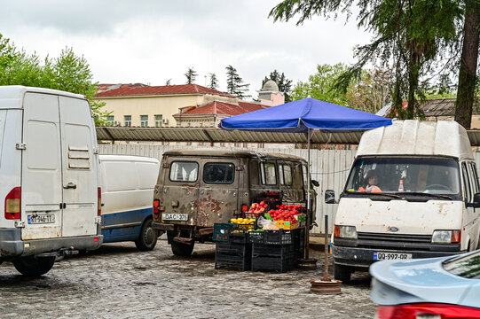 An old UAZ-452 &ldquo;Buhanka&rdquo; van and a Ford Transit van at the market in Kutaisi; historic commercial vehicles in everyday use near the Green Bazaar, Imereti, Georgia 05.04.25