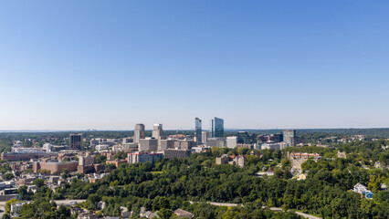 Naklejka premium Downtown White Plains skyline above tree-filled neighborhoods in Westchester County, New York