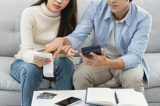 Family financial concept, Stressed wife and husband have a problem to pay loan can not pay credit card debt.