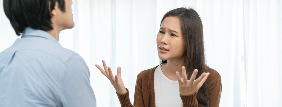 Family problems, Asian couple quarrel together at home. woman angry on man and man feel annoy.