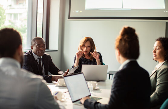 Diverse business team meeting in modern office conference room