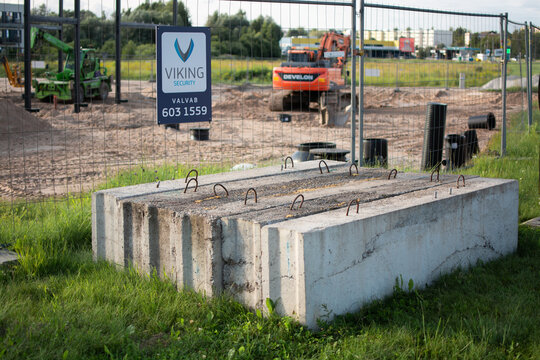 Tartu, Estonia-25 July, 2026. Stack of reinforced concrete FBS foundation blocks with metal loops