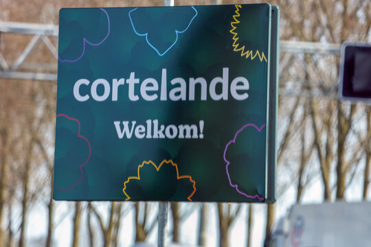 Welcome to the new village Cortelande signs