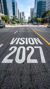 Vision 2027 Painted on Asphalt in Urban Cityscape.
