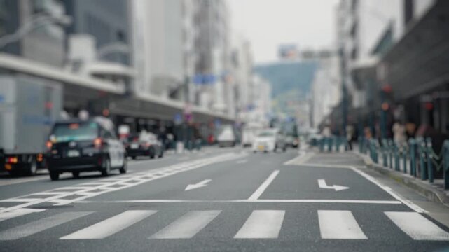 Cyclist riding folding bicycle across urban street