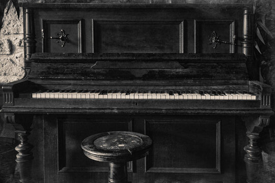 Grunge old piano artistic photography. Aged retro musical instrument. Real photo.