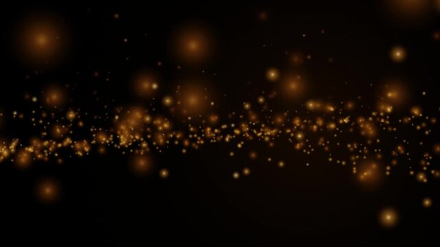 Golden dust particles floating on black background, abstract luxury motion bokeh