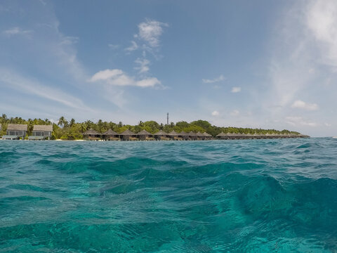 View of overwater bungalows on a tropical island
