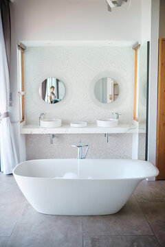 Modern bathroom with freestanding bathtub and double sinks