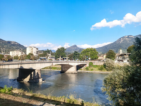 Mountain river within the city limits.  Color photograph of a mountain river and green spaces in an urban landscape.