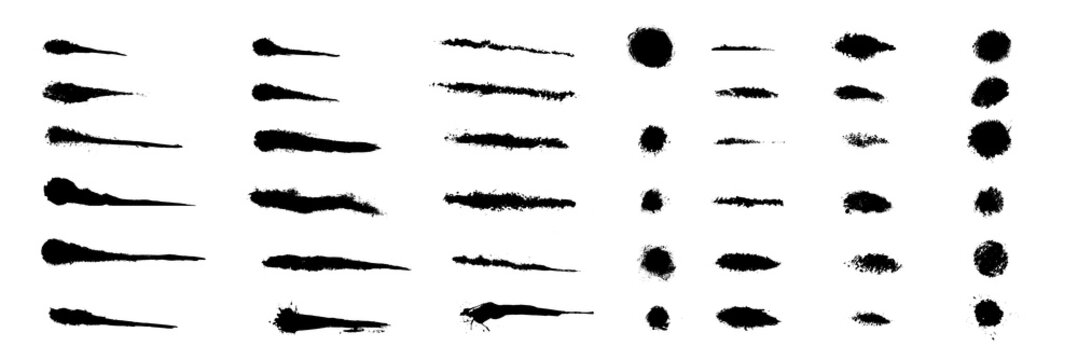 Black vector set of soft spray strokes, ink smears, dots and rough brush marks with grunge texture, isolated on white for highlights, accents and creative design.