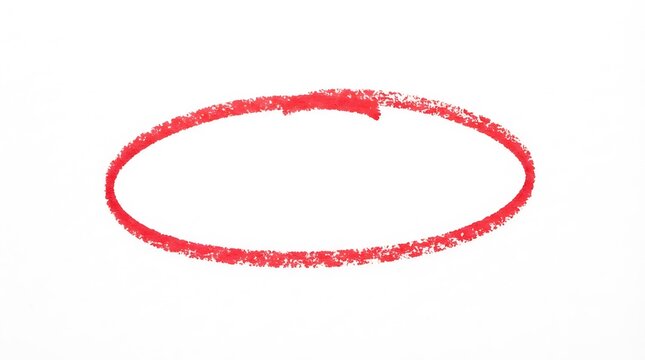 Red hand drawn circle made with wax crayon isolated on a plain white background for design emphasis