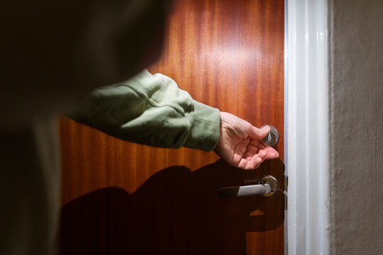 Man checking door lock at home