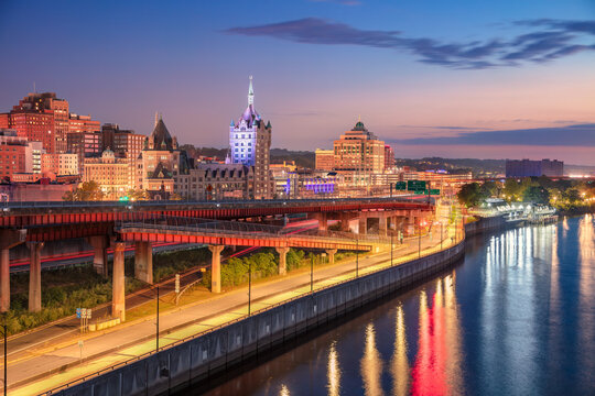 Albany, New York, USA. Cityscape image of Albany, New York with reflection of the city skyline in the water at beautiful sunrise.