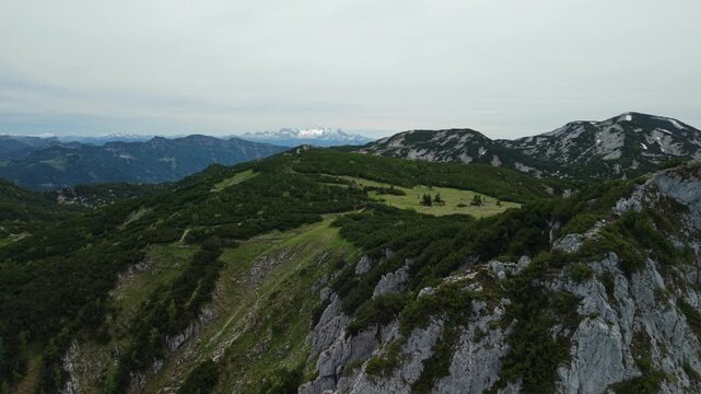 Aerial view of rocky cliff edge at Alberfeldkogel with Dachstein glacier