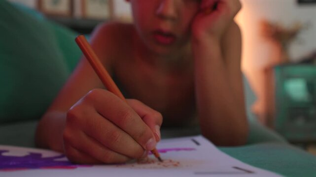 Close up of child hand drawing with pencil on paper showing detail and creative process concept of focus precision and artistic development