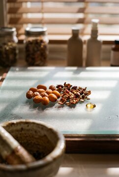 Natural Herbal Ingredients, Sea Buckthorn Berries and Oil Capsule on Glass Plate for Organic Skincare and Medicine