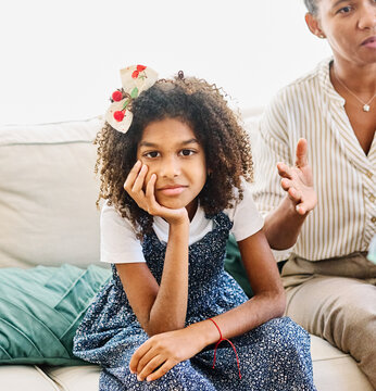 Mother with her teenage daughter at meeting with social worker, psychologist discussing mental health family sitting on sofa in psychotherapist office