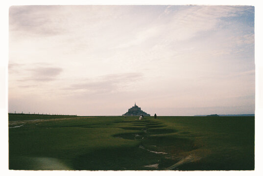Mont Saint-Michel seen from a distance at sunset