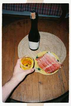 French aperitif with cider, cured ham and snacks