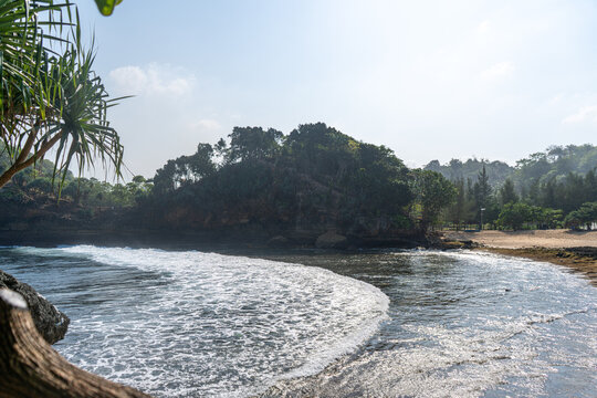 view of the shoreline with small waves on Batu Bengkung Malang