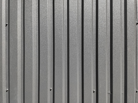 Grey corrugated metal wall texture background