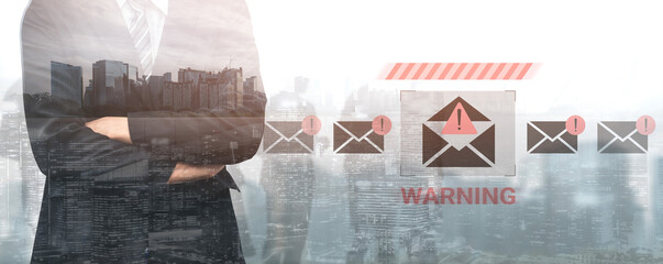 A businessman stands with arms crossed, conveying a sense of caution amidst city scenery, emphasizing the importance of email security and communication awareness. Gantry © InfiniteFlow