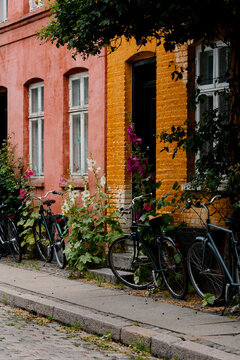Historic Copenhagen building facade with row of bicycles on the street