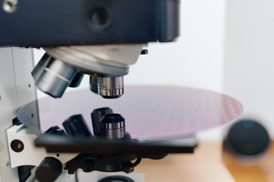 Laboratory Scene Showing Microscope Focusing on a Silicon Wafer