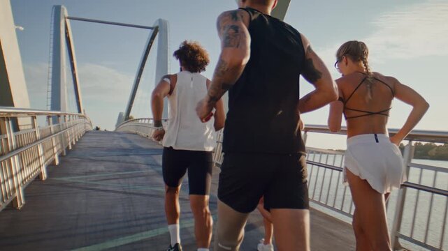 Group of runners trains with amputee athlete along modern bridge