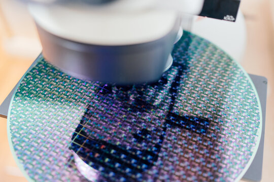 Microscope Examining a Silicon Wafer in a Lab Setting
