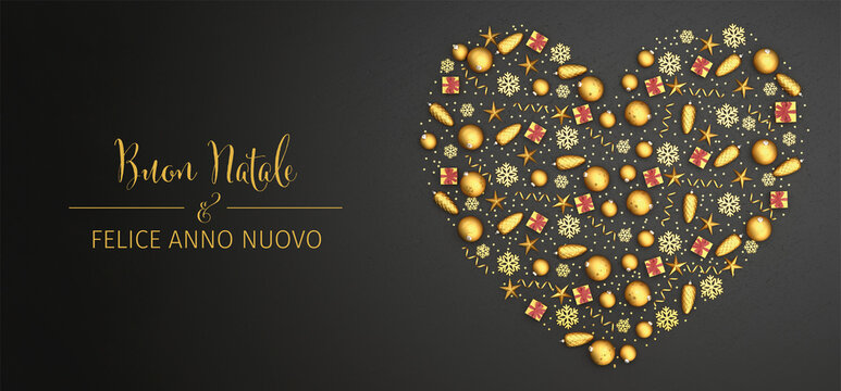 Flat lay golden christmas ornaments arranged as a heart on a black stone plate. Italian text "Buon Natale & Felice Anno Nuovo" (Merry Christmas & Happy New Year). Web banner
