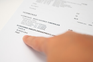 Fototapeta premium Hand pointing to aneuploidy preeclampsia screening blood test results