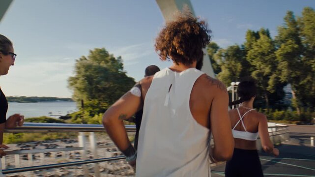 Fitness group continues morning run along riverside pathway