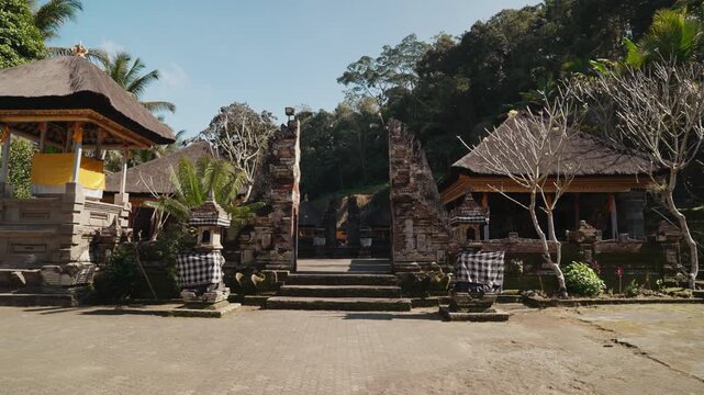Traditional Balinese temple entrance and stone architecture at the historic Gunung Kawi Temple complex in Tampaksiring Bali Indonesia