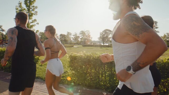 Adaptive male runner joins fitness group during outdoor park run
