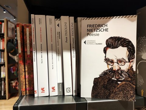 Rome, Italy - August 20, 2026, a Feltrinelli bookshop with a series of literature books, including the volume Poems, by Friedrich Nietzsche (author), Susanna Mati (editor), Feltrinelli, 2019.