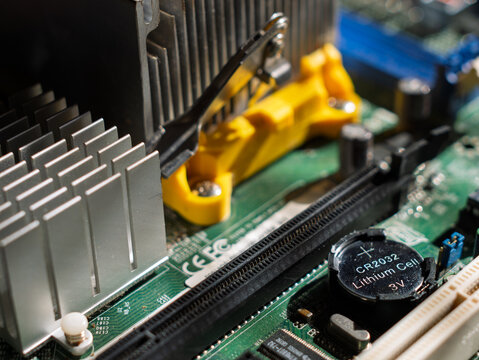 Close-Up of Computer Motherboard Components and Battery