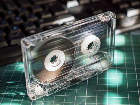 Retro Audio Cassette Tape on Green Cutting Mat
