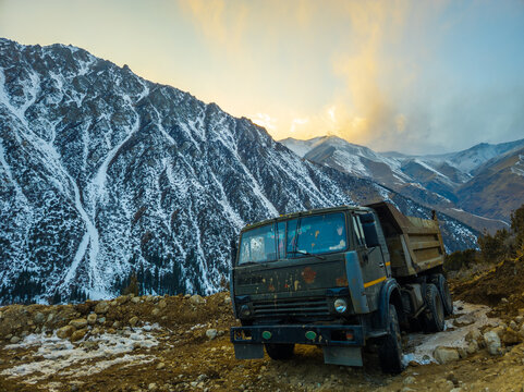 Heavy-Duty Dump Truck on Rocky Road in Kyrgyzstan
