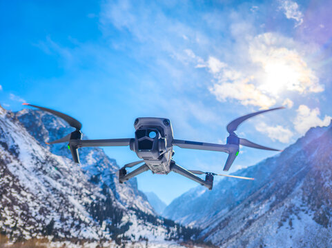 Drone Flying Over Snow-Covered Mountains in Kyrgyzstan