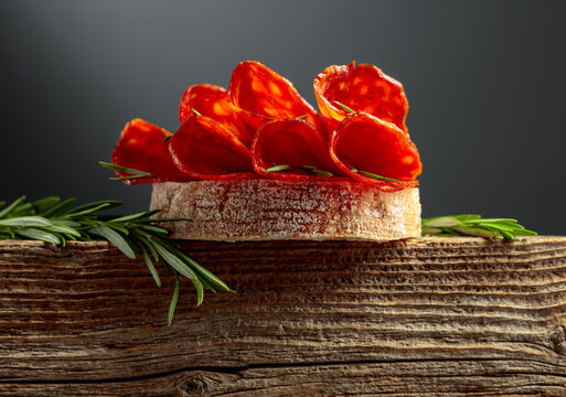 Sandwich with thin slices chorizo sausages.