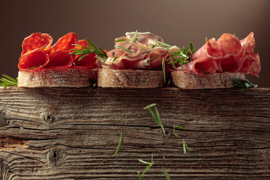 Sandwich with thin slices of Italian dry cured prosciutto, salami, and chorizo sausages.